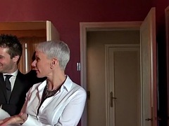 Sexy short-haired MILF is sodomized in the kitchen