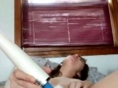 Amateur using wand on naked pussy