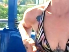 Hot MILF Shows off Her Boobs at Public Amusement Park (Quick tit Flashes)