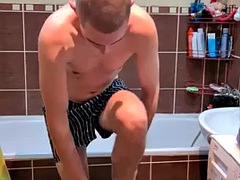 Taking a shower and shaving armpits in the bathroom. Amateur homemade video