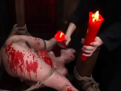 Helpless Asian lady gets covered in wax and is made to cum